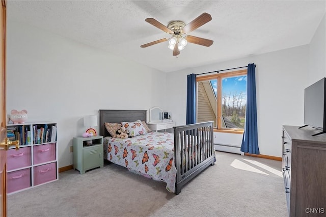 bedroom featuring carpet floors, a textured ceiling, baseboards, and baseboard heating