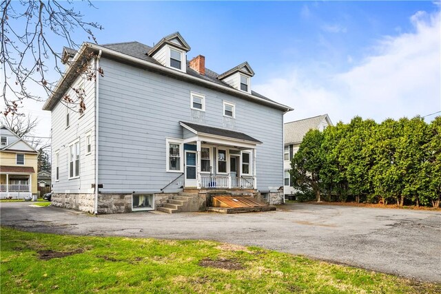 rear view of house with a porch