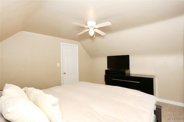 bedroom featuring baseboards, ceiling fan, light colored carpet, and lofted ceiling
