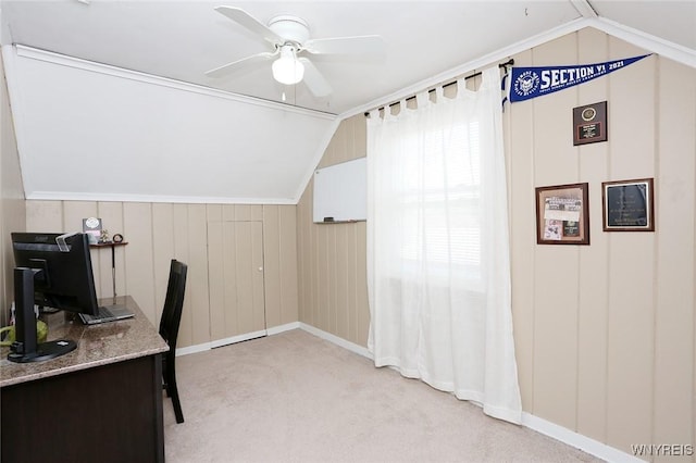 office space featuring baseboards, a ceiling fan, lofted ceiling, and light carpet