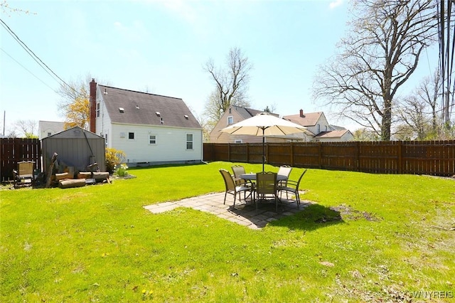 view of yard with a fenced backyard and a patio area