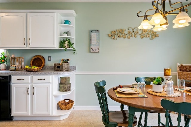 dining space with baseboards and a notable chandelier