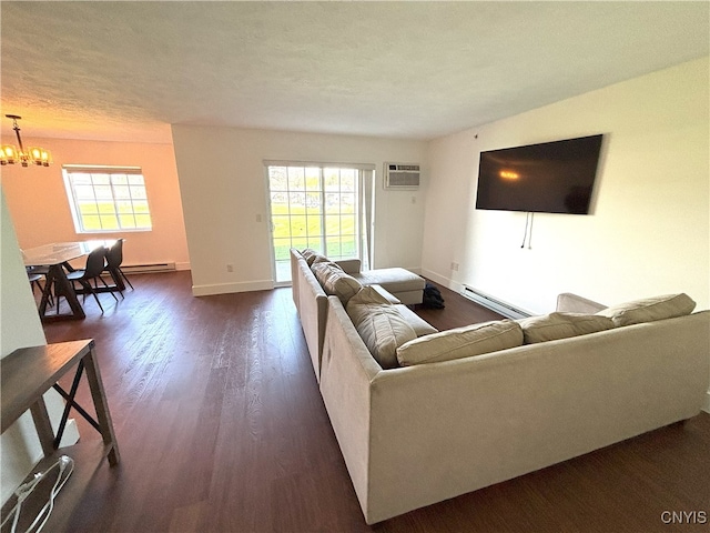 living room with dark wood-style flooring, an AC wall unit, a chandelier, baseboards, and a baseboard radiator