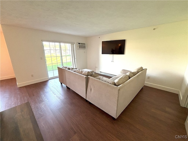 living area with baseboards, dark wood finished floors, a wall mounted AC, and a baseboard radiator