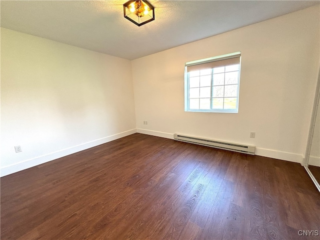 unfurnished room featuring baseboards, a baseboard radiator, and dark wood finished floors
