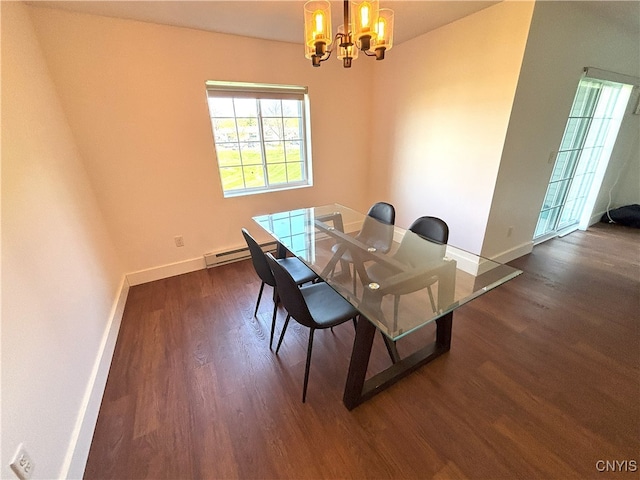dining space featuring baseboards, a notable chandelier, and dark wood-type flooring