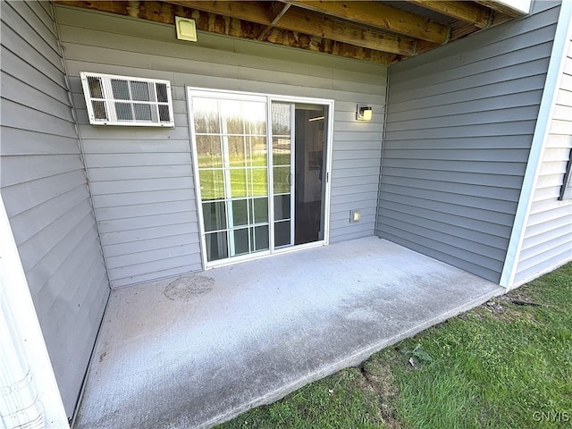 view of patio / terrace with a wall unit AC