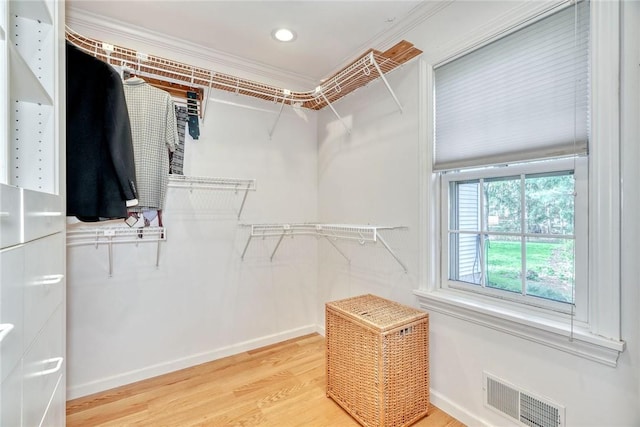 spacious closet with visible vents and light wood-style floors