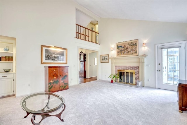 carpeted living room with high vaulted ceiling and a fireplace
