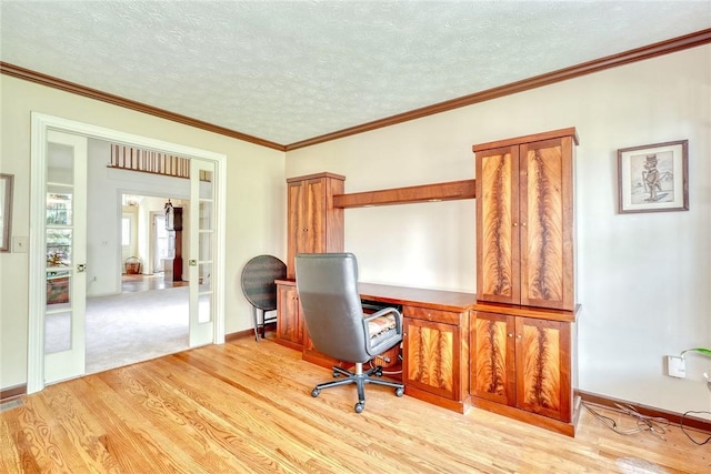 home office with french doors, a textured ceiling, light wood finished floors, and ornamental molding