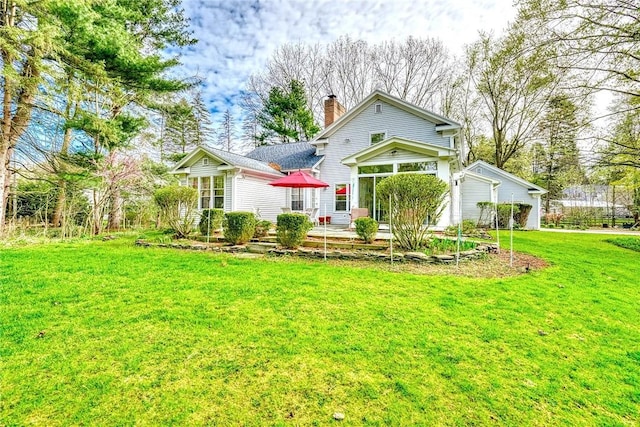 back of property featuring a lawn and a chimney