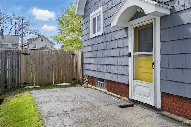 exterior space with fence and a patio area