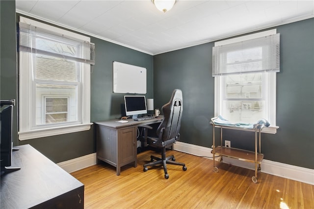 office area featuring baseboards and light wood-type flooring