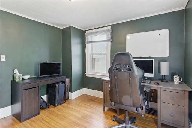 office area with crown molding, baseboards, and light wood finished floors