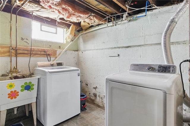 clothes washing area with laundry area and washer and dryer