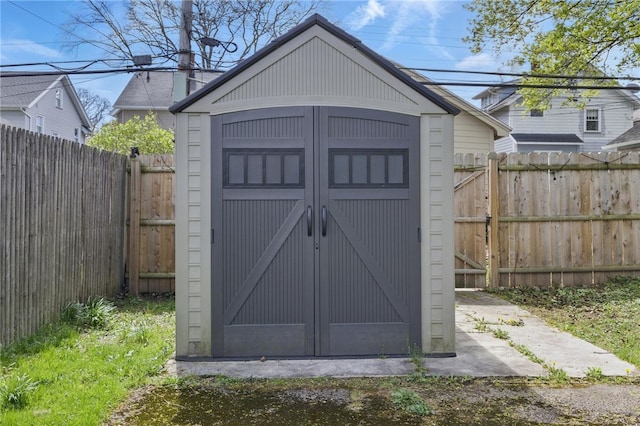 view of shed featuring a fenced backyard
