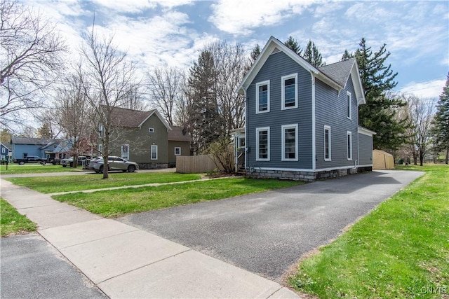view of property exterior featuring a lawn