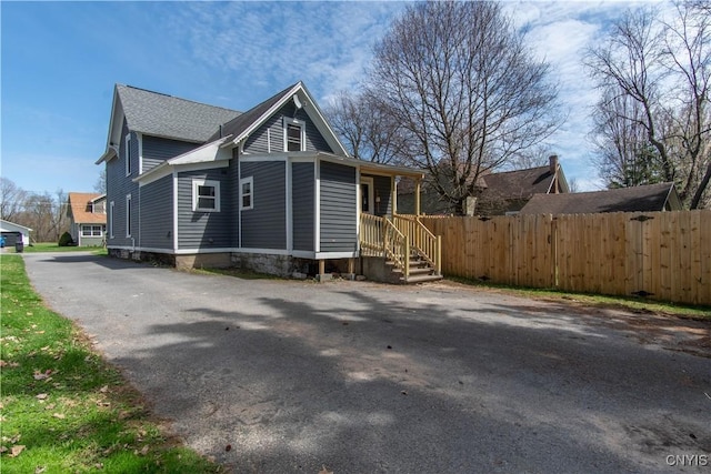 view of front of home with fence