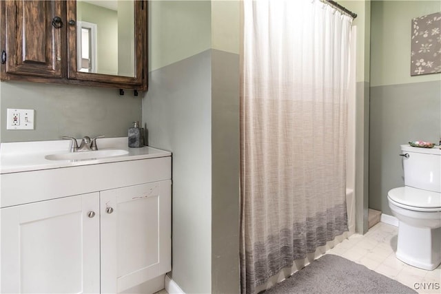 bathroom featuring toilet and vanity