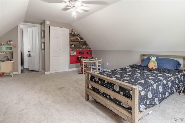 bedroom featuring baseboards, carpet, a ceiling fan, and lofted ceiling