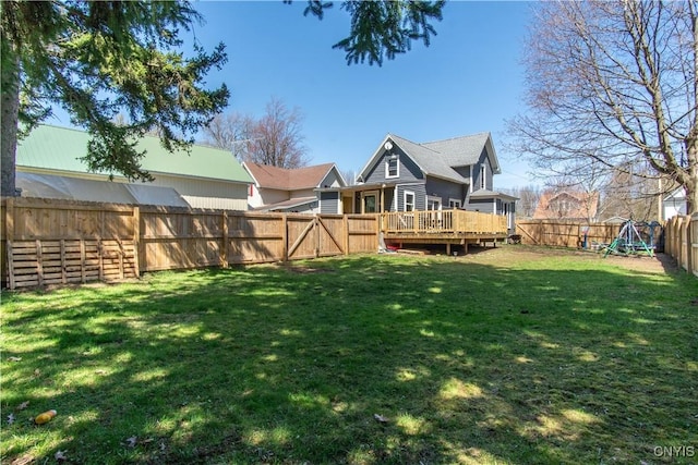 view of yard featuring a deck and a fenced backyard