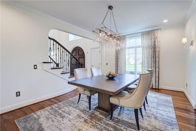 4 Windscape Park, Pittsford, NY 14534 - dining space with crown molding, wood finished floors, baseboards, stairway, and arched walkways