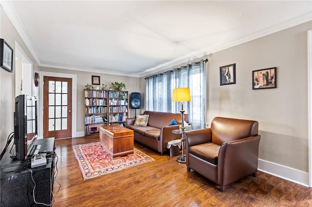living room featuring ornamental molding, a wealth of natural light, and wood finished floors