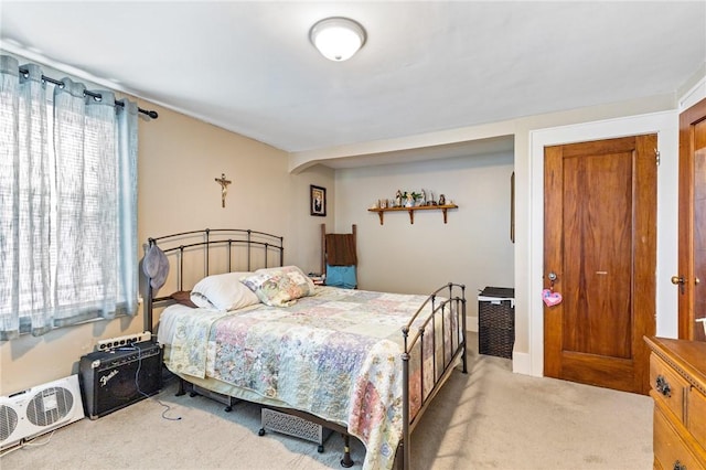 carpeted bedroom with multiple windows