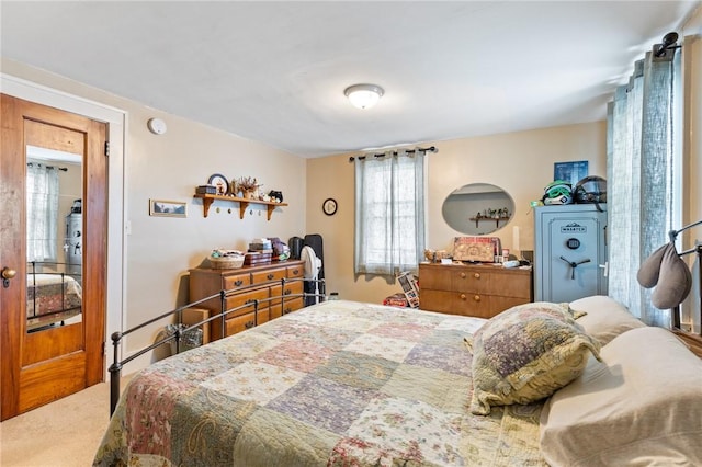 carpeted bedroom with multiple windows