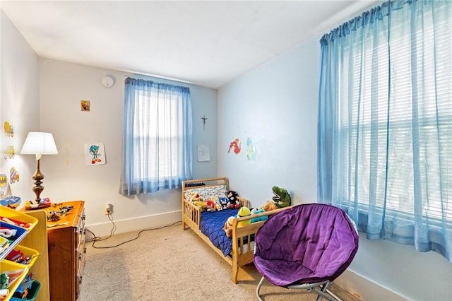 carpeted bedroom with baseboards