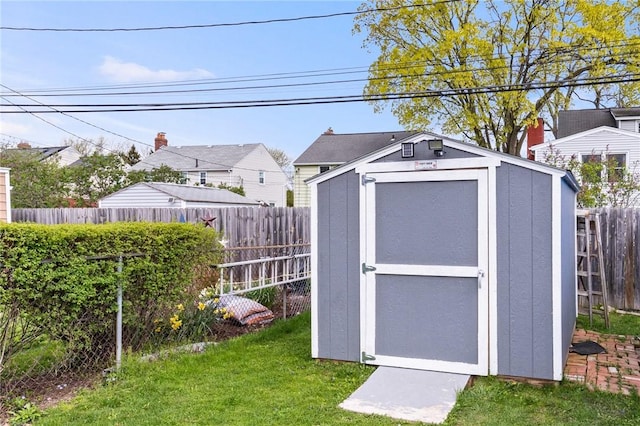 view of shed featuring a fenced backyard