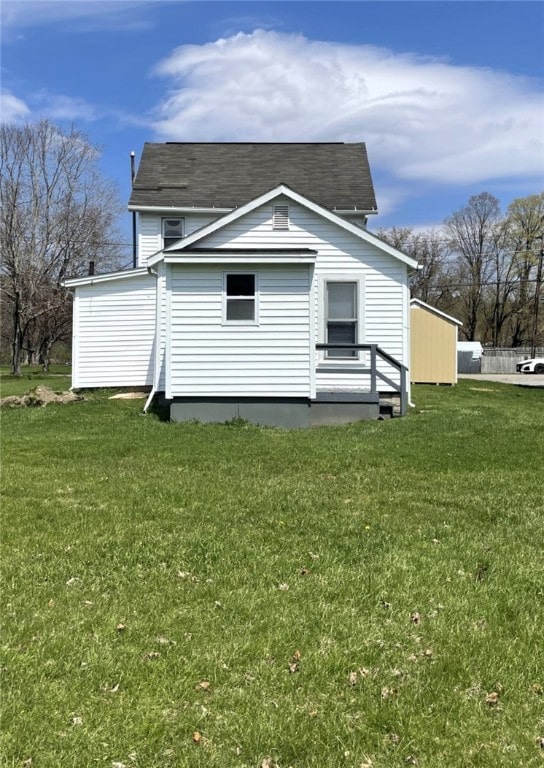 25 W Greenwood St, Andover, NY 14806 - rear view of house featuring a lawn and a shingled roof