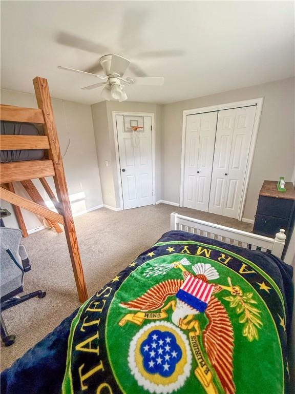 bedroom with baseboards, ceiling fan, and carpet