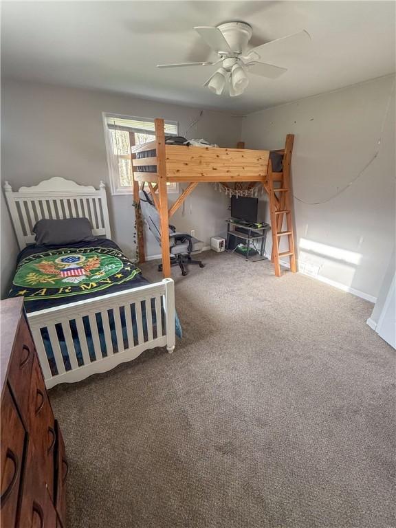 carpeted bedroom featuring a ceiling fan