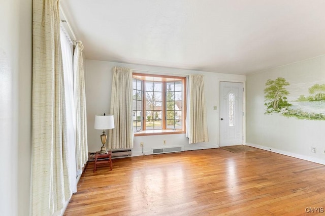 314 Westlind Rd, Geddes, NY 13219 - entryway with baseboards, wood finished floors, and visible vents