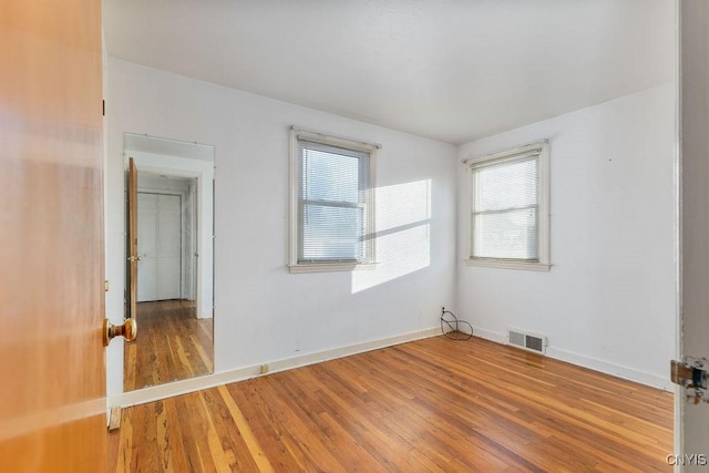 314 Westlind Rd, Geddes, NY 13219 - spare room featuring visible vents, baseboards, wood finished floors, and a wealth of natural light