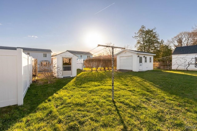 314 Westlind Rd, Geddes, NY 13219 - back of property featuring an outdoor structure, fence, and a yard
