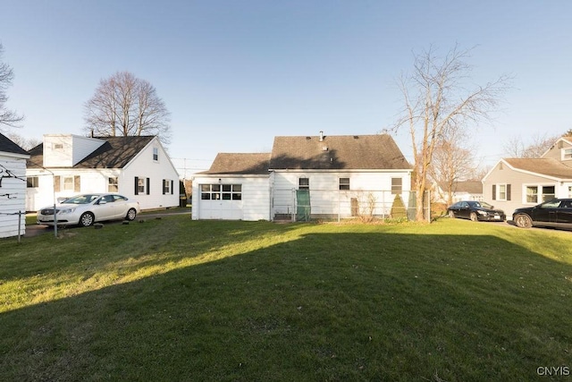 314 Westlind Rd, Geddes, NY 13219 - rear view of property with a lawn and a garage