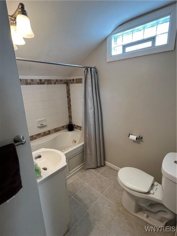 full bathroom with toilet, vaulted ceiling, tile patterned flooring, and shower / tub combo with curtain