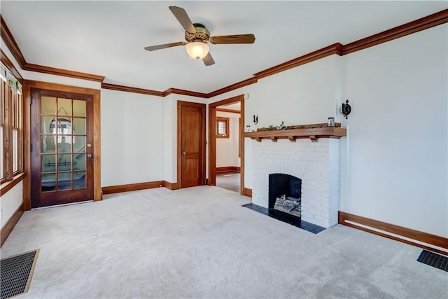 unfurnished living room featuring crown molding, baseboards, carpet flooring, and visible vents