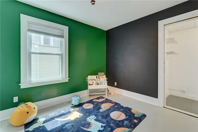 interior space featuring baseboards