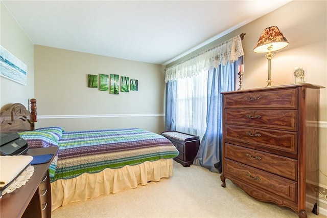 bedroom with light colored carpet