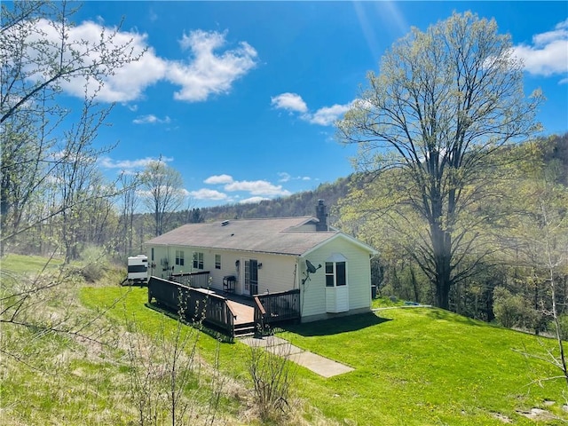 5291 Starr Rd, Thurston, NY 14821 - back of property with a yard, a chimney, and a wooden deck
