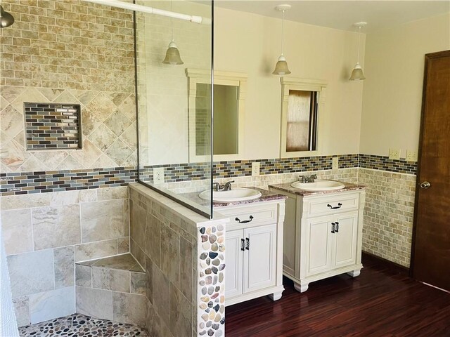 5291 Starr Rd, Thurston, NY 14821 - bathroom with a sink, wood finished floors, tile walls, and a shower stall