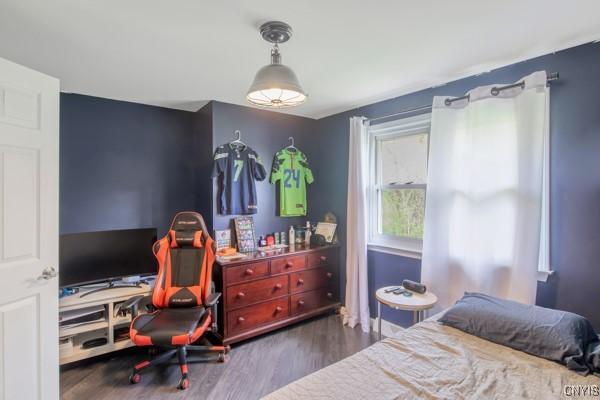 bedroom with wood finished floors