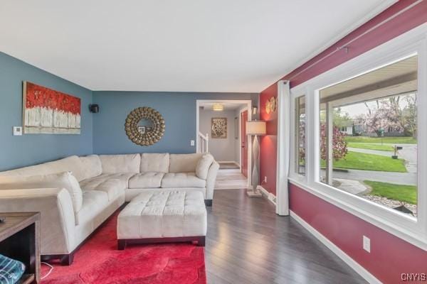 living room featuring baseboards and wood finished floors