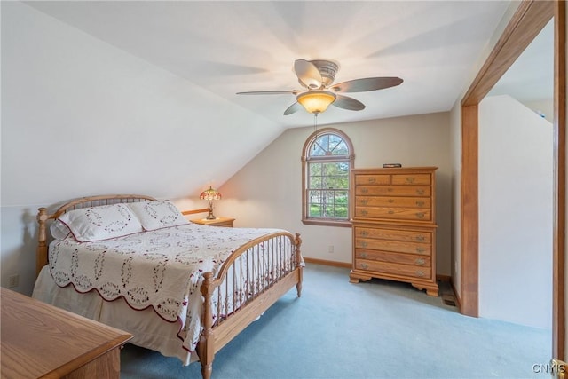 carpeted bedroom featuring baseboards, ceiling fan, and lofted ceiling