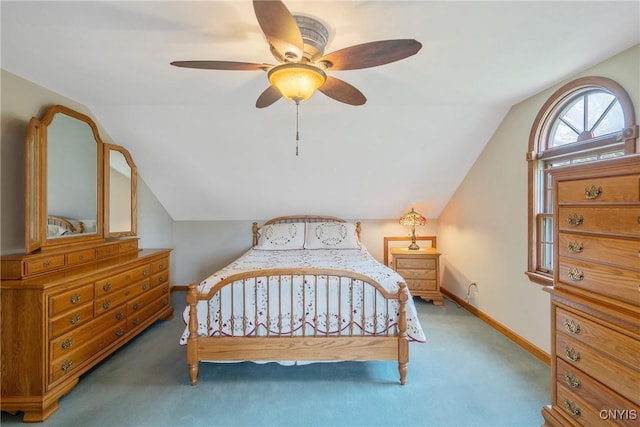 bedroom with baseboards, carpet flooring, ceiling fan, and lofted ceiling