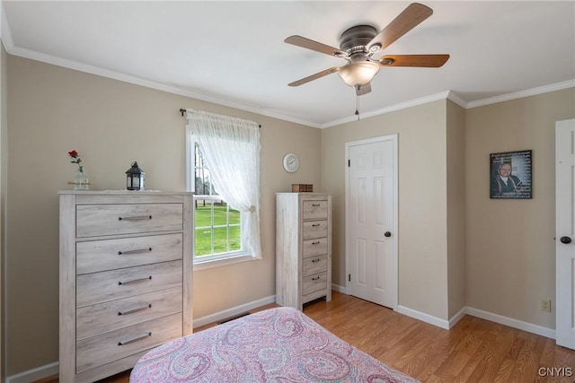 bedroom featuring crown molding, a ceiling fan, baseboards, and wood finished floors