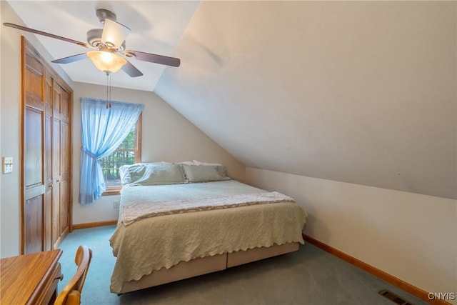 bedroom with baseboards, a ceiling fan, vaulted ceiling, and light colored carpet
